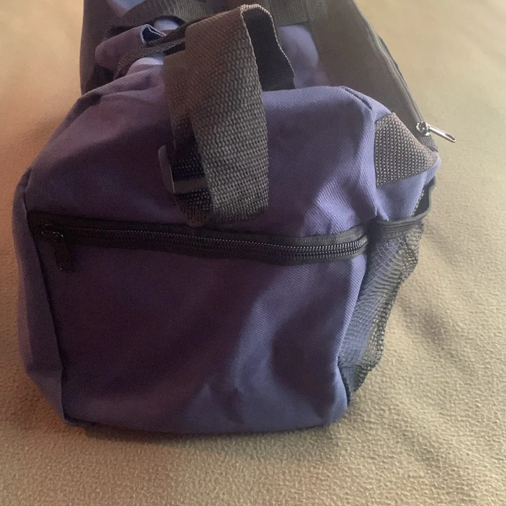 Smithsonian Air & Space blue and black duffel bag. Approx 17” x 9” x 7 1/4”